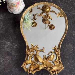 Antique French Rococo style bronze vanity mirror detailed with a sculpted peacock and swan among branches.