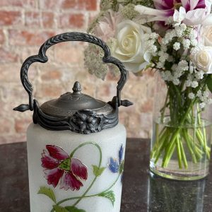 Antique hand-painted biscuit jar with floral motifs and metal lid