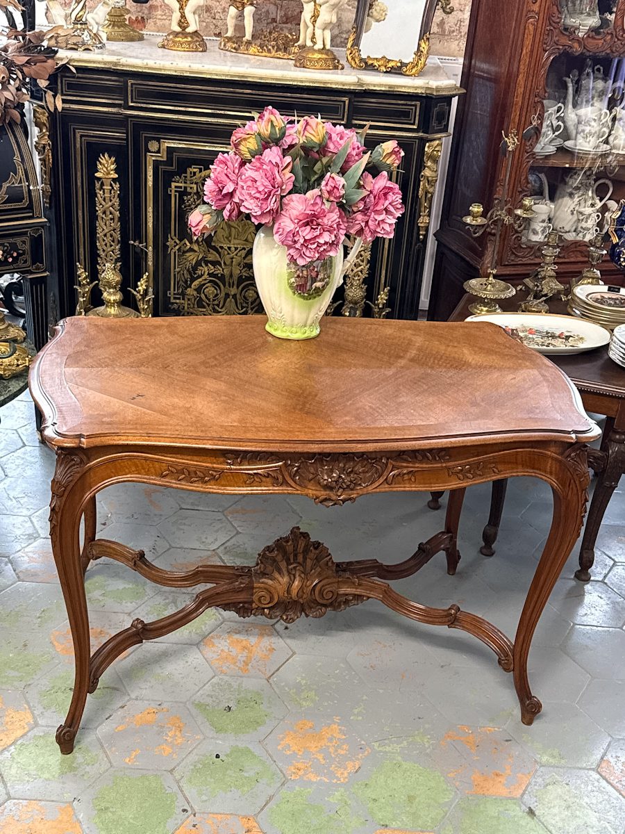 Louis XV style carved walnut table with rocaille apron and cabriole legs